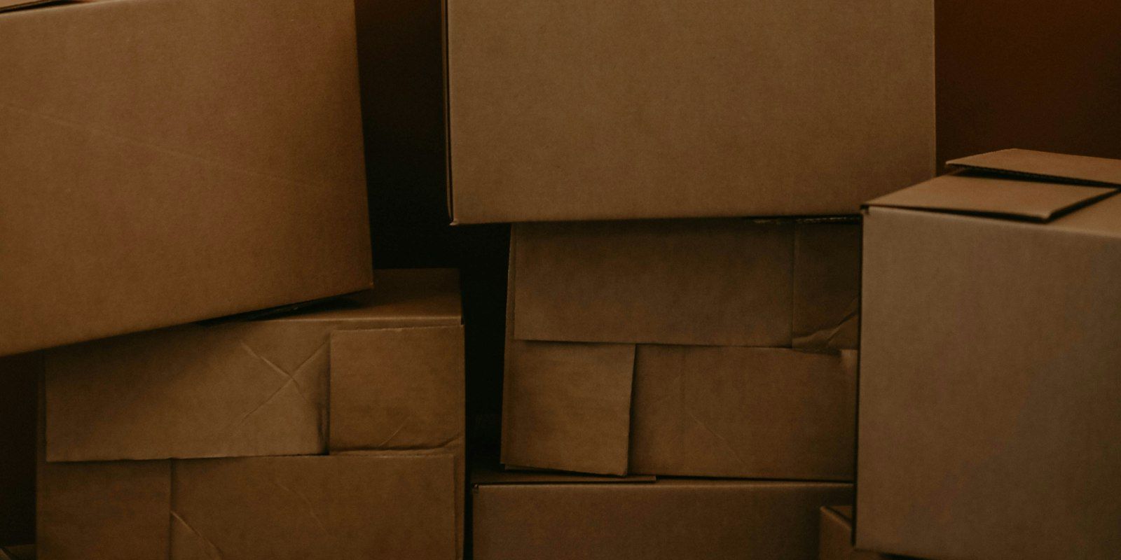 A stack of plain brown cardboard boxes.